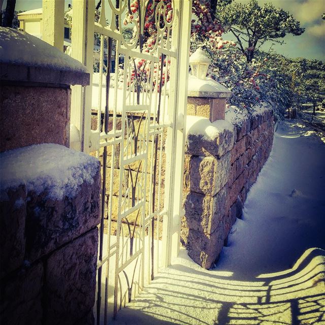A gate  shadows and  lights  gate  snow  stone  iron  pattern  mountain ...