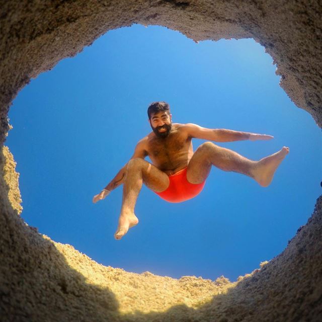A Hole New World 🕳 jump  fun  hole  legs  sky  summer  beach  beard  air... (Bahr Sour)
