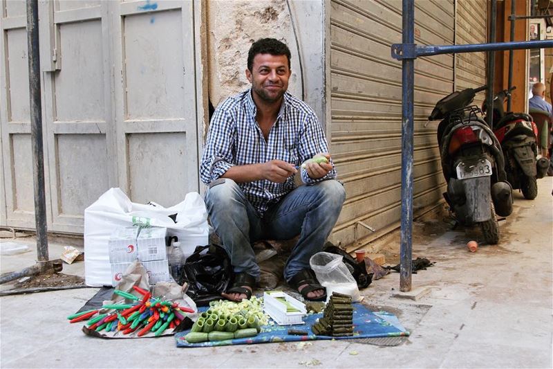 By the side of the road in Tripoli and also other places in Lebanon, men...
