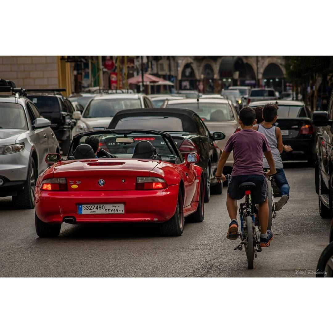 Chasing the big boys  cars  lebanon  street  bikes  kids  streetphoto ... (Aley)