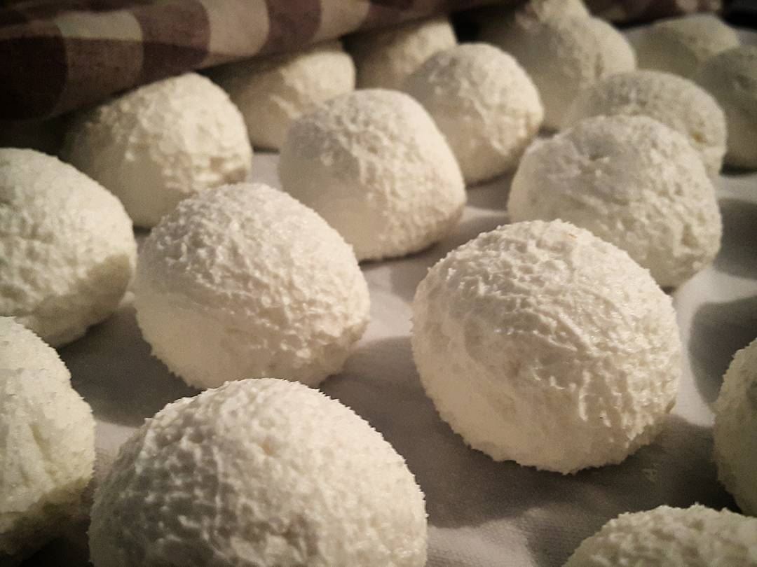 Fluffy homemade labneh in the making. Freshly rolled into balls after we...
