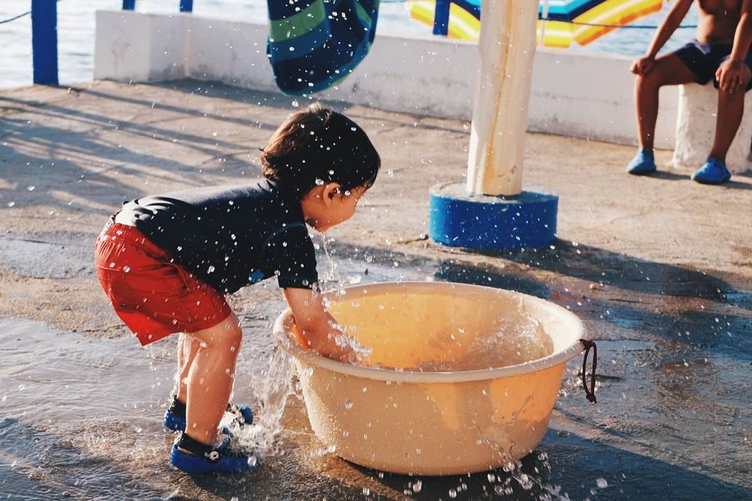 "Happiness is... playing with water" kids  happiness  fun  summer  water ... (Ta7t El Ri7 - Anfeh)