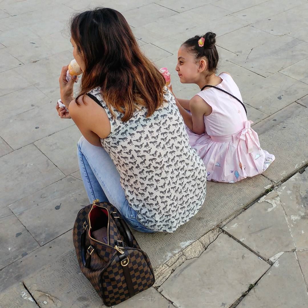 Is there anything cuter than a lil' girl sitting next to her mom licking... (Deïr El Qamar, Mont-Liban, Lebanon)