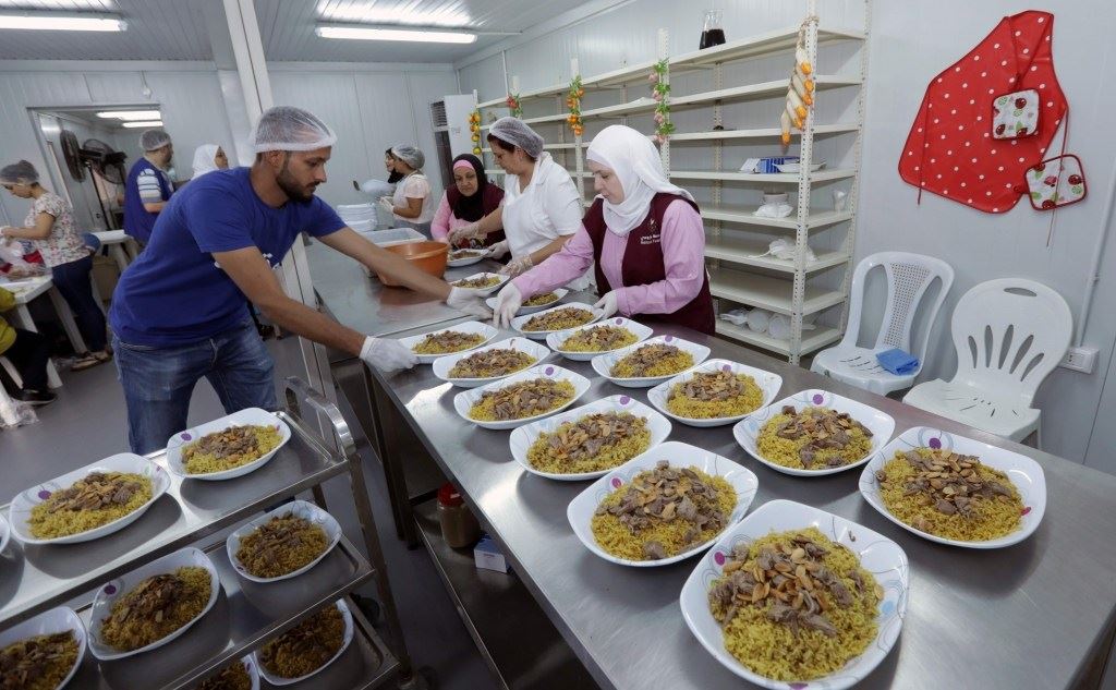 Lebanese and Syrians prepare dishes for an “Iftar” in Beirut, Lebanon. (Anwar Amro / AFP)
