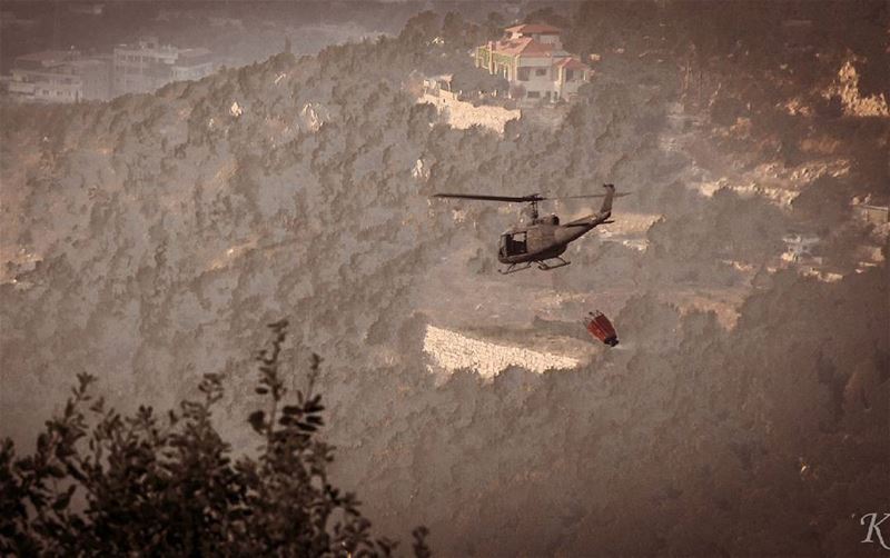Lebanese army huey helicopter, helping firefighters put out the massive... (Aley)