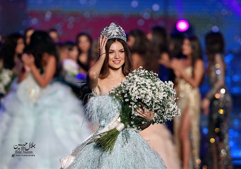 Lebanese Maya Reaidy, newly crowned Miss Lebanon, fixes her crown after...