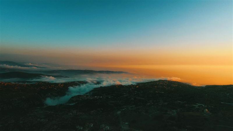 Lebanon's sunset from an above the cloud's view; droning high ... (Souk el Akel)