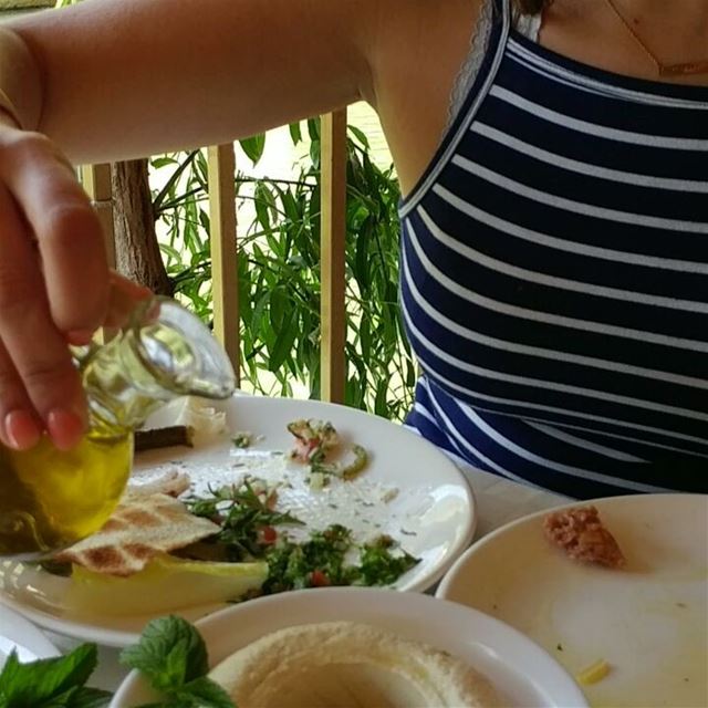 Let's just smother the hummus with olive oil, slurp.  hummus  oliveoil ... (Hasbaya)