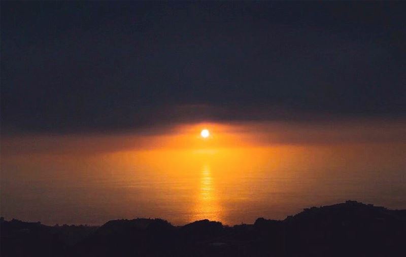 Let your eyes focus on the sun sinking down in the sea in the form of an... (Lebanon)