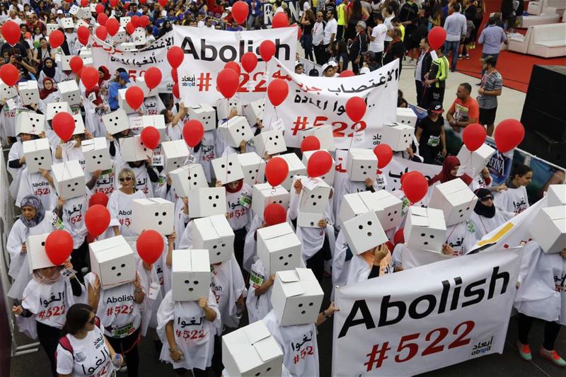 Participants, demanding the abolishment of article 522 of Lebanon’s Penal code, during Beirut Marathon