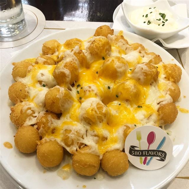 Potato balls topped with cheese and extra amount of cheese 🧀 😋👌 so... (Achrafieh, Lebanon)