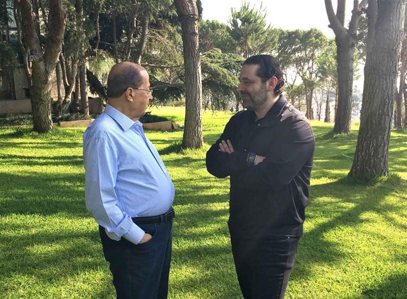 President Michel Aoun walking with Prime Minister Saad Hariri in the garden of the presidential palace of Baabda. (Dalati And Nohra)