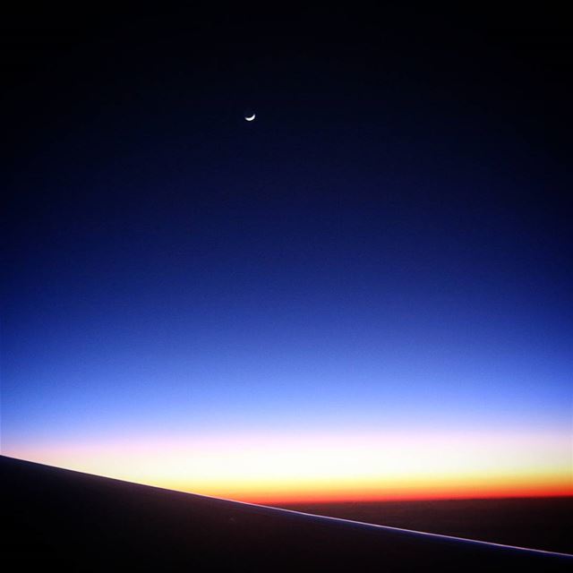 Sunset from the Plane.. i was lucky enough to catch the moon!...