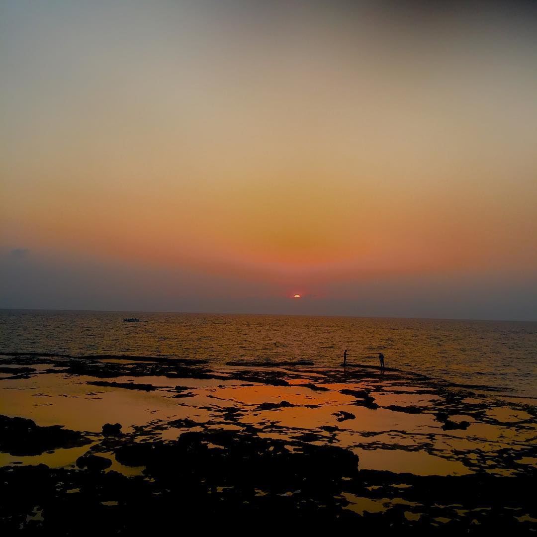 sunsetting from al-mina burning the sea more than the sky in orange... (Corniche El Mina Tripoli)
