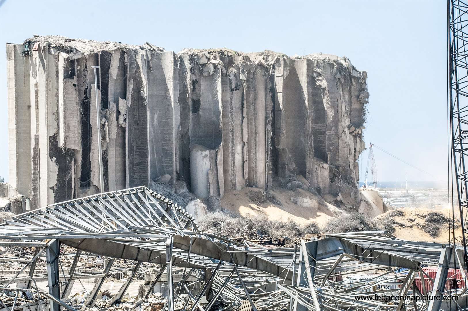 The still standing wheat storage and the explosion area in Beirut Port