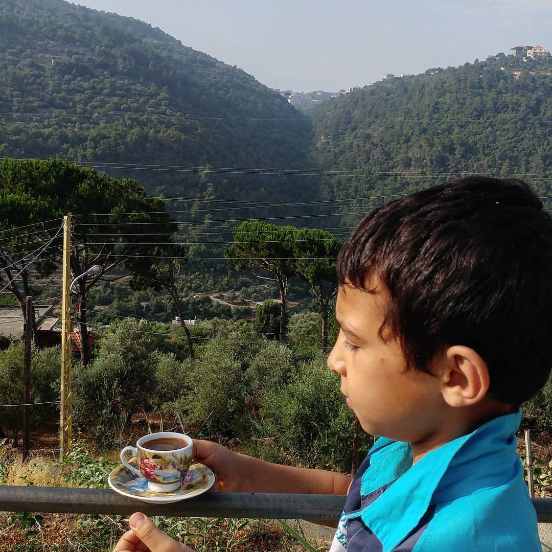 Wassim, 10, is setting my coffee prepared by his older brother against the... (Dayr Al Qamar, Mont-Liban, Lebanon)