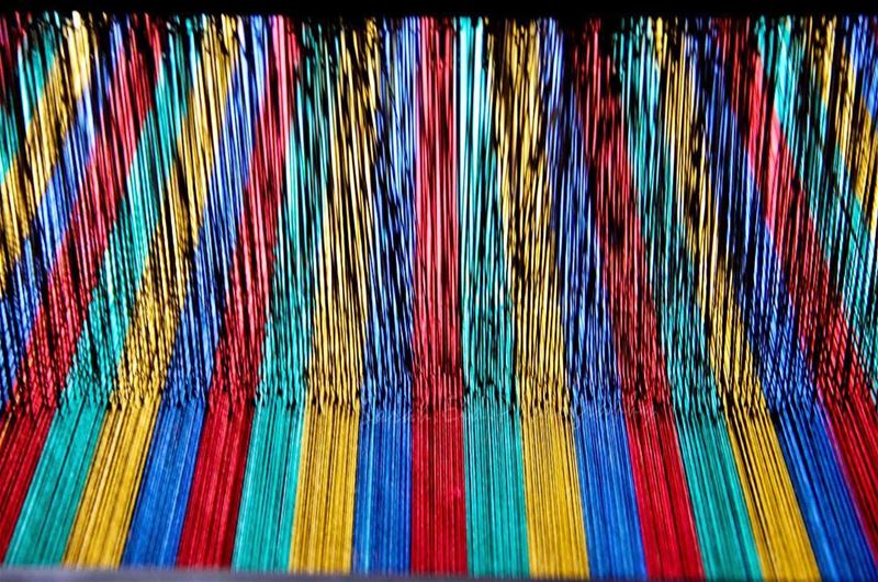 Weaving is a textile production method which involves interlacing a set of... (Beït Chabâb, Mont-Liban, Lebanon)