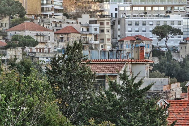 Windows and rooftops.. and a man in a white suit..Beit Meri  Lebanon .....