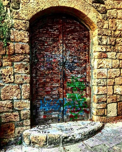 Writings on the wall door  old  writings  noperson  daylight  travel ... (Jbeil-Byblos)