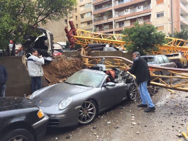 A crane in syoufi near Achrafieh fell because of strong wind damaging cars and balconies near by