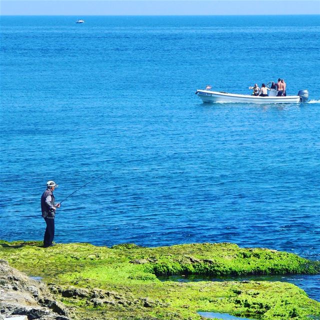 A day in the sun... 🎣🚤 beirut  lebanon  splash  sea   bluesea  rocks ... (Ain El Mreisse, Beyrouth, Lebanon)