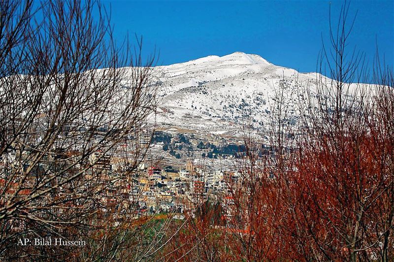 A general view shows mountains covered with snow in Dahr al-Baydar, Mount...