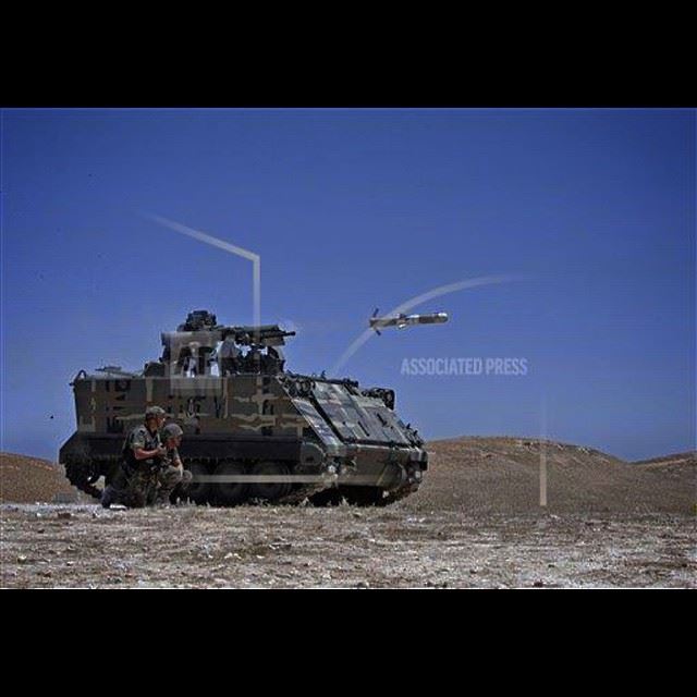 A Lebanese army vehicle fires a TOW-II missile in the village of Taybeh,...