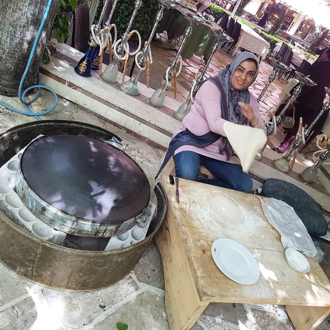A local woman gives a demonstration how to make a Lebanese flatbread. She... (Zahlé, Lebanon)