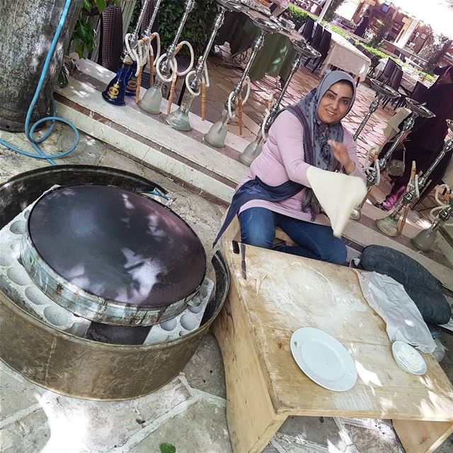 A local woman gives a demonstration how to make a Lebanese flatbread. She... (Zahlé, Lebanon)
