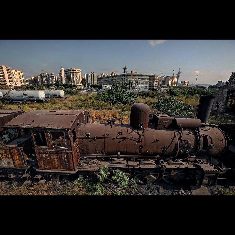 A rusted locomotive is seen at the defunct train station, in the northern...