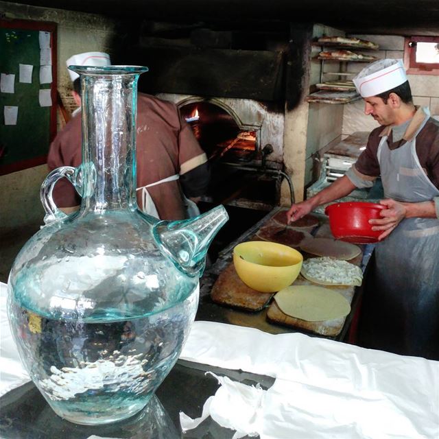 A swig of water while waiting for breakfast.  cornerbakery  jug ... (Deïr El Qamar, Mont-Liban, Lebanon)