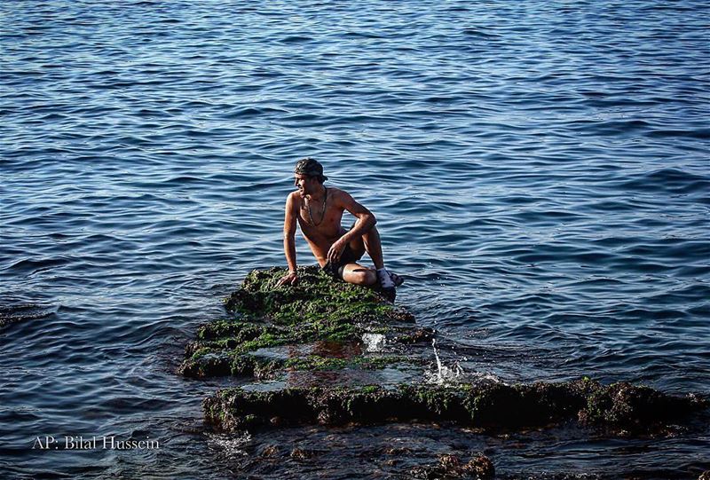 A Syrian man takes advantage of an unseasonably warm January afternoon, at...