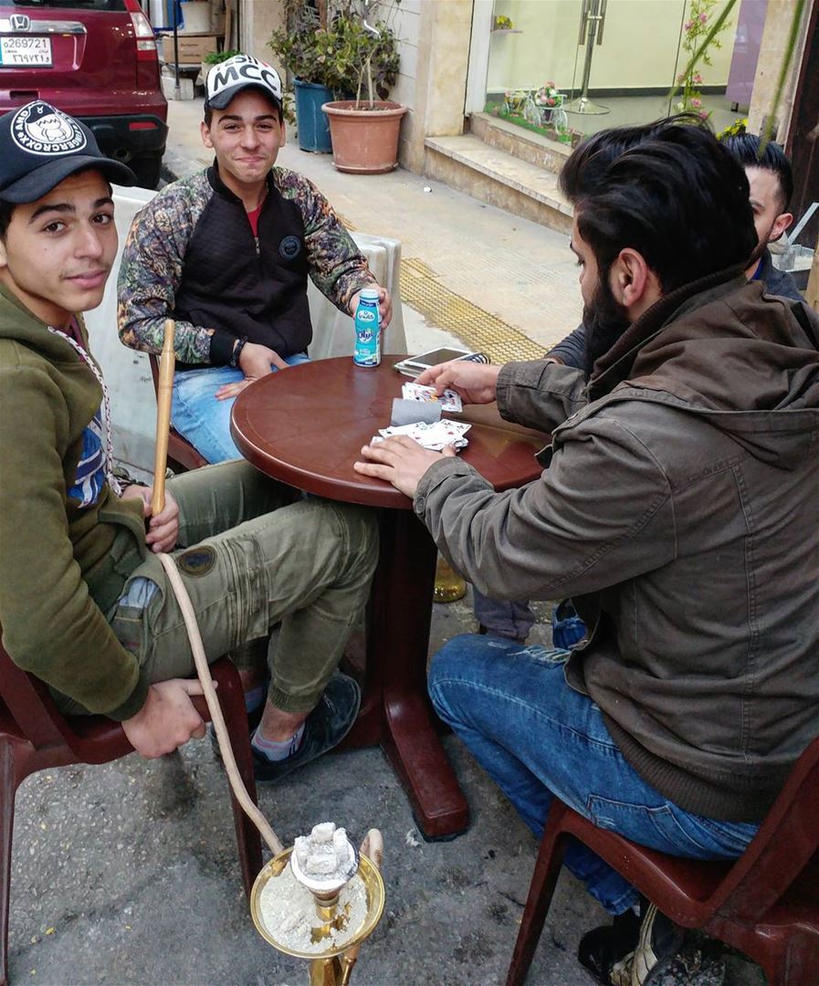 A typical Lebanese scene. Four guys taking a break from work set-up table,... (Beirut, Lebanon)