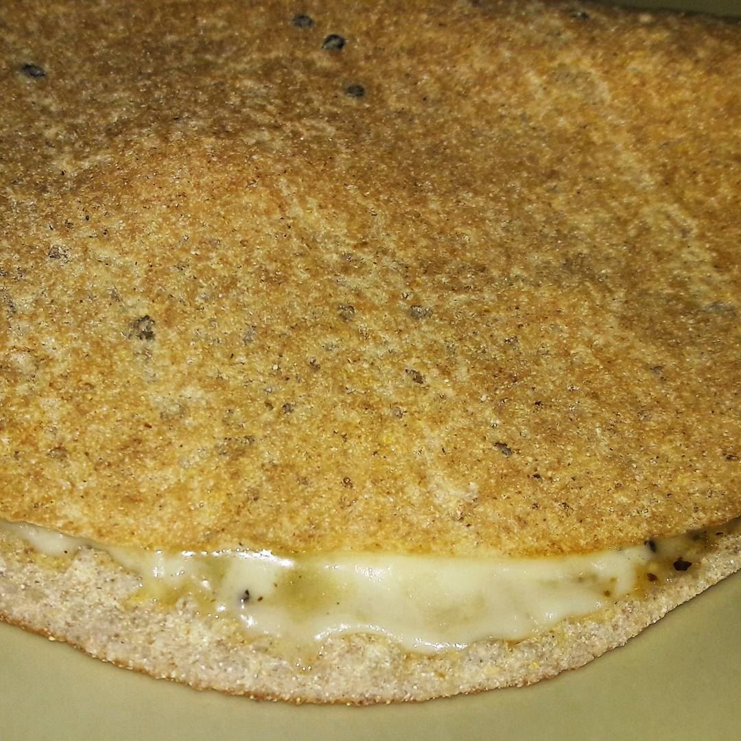 A very thin oatmeal bread stuffed with melted Halloum cheese and... (Tripoli - Abi Samra)
