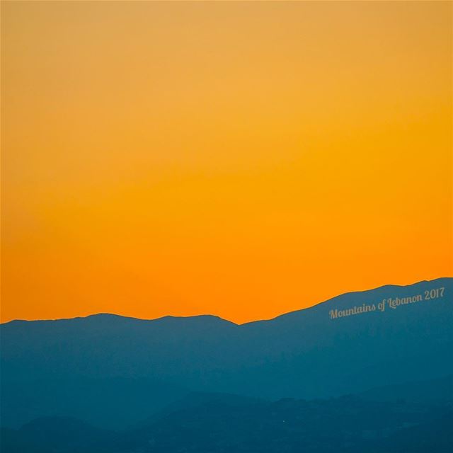 Abstract sunrise in blues and Gold...over jabal makmel and jabal el... (Ras Maska)