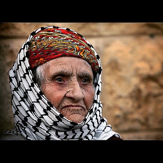 An Iraqi Chaldean Christian woman, who fled her home from Iraq, waits for...
