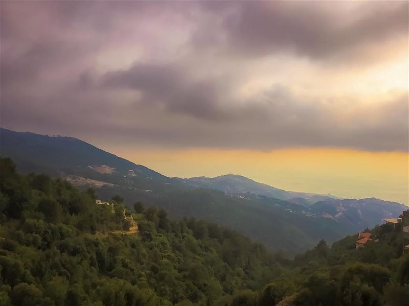 An opening over the sea  mountains  landscape  clouds  season ...