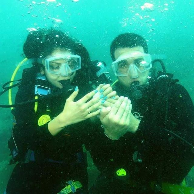 And she said YES in the coolest way ❤❤❤ diving romantic engagement love...