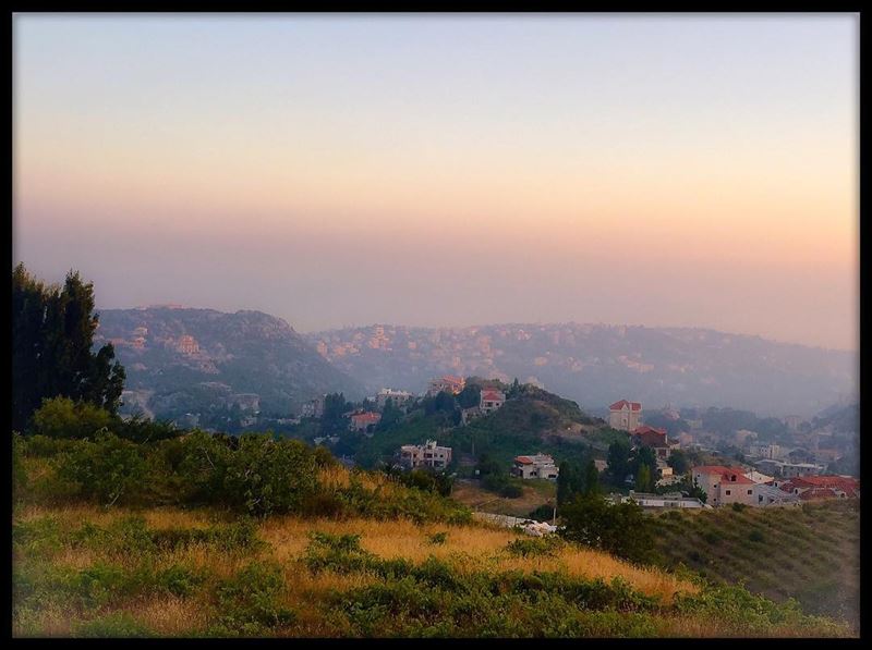 Another beautiful  sunset over the  mountain  landscape  village  houses ...