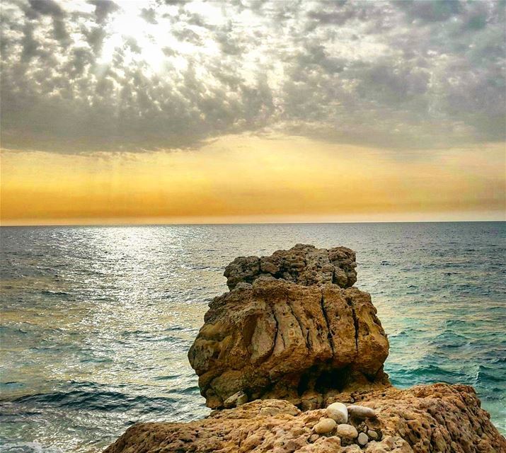 At the end of the horizon.  susnset  lebanon  coast  beach  rock  rocks ...