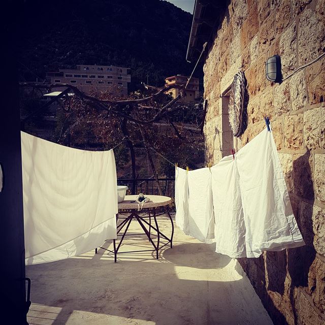 Bed sheets drying in the open, fresh air. Taking their time. Like in the...