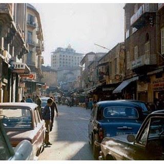 Beginning of Souk El Nouriyyeh behind cinema Opera that became the Virgin Megastore Building Beirut 1975 .
