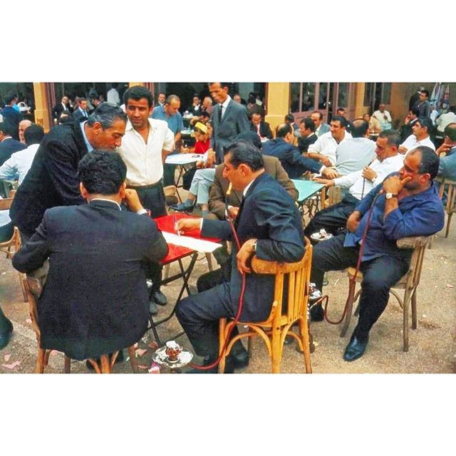 Beirut Prosperous Men Smoking Nargileh at the  horse race track and waiting for the results @beiruthippodrome 1966 .