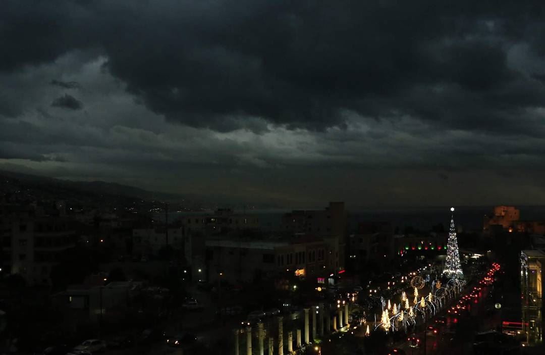  black  clouds above and  holidaylights on the ground... thisislebanon79 ... (Byblos, Lebanon)