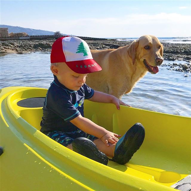 Bound  buddies 👦🏼🐶 •••• MyLifeaAMoi  Lebanon  beach  dog  kid  sea ... (Colonel Beer Batroun)
