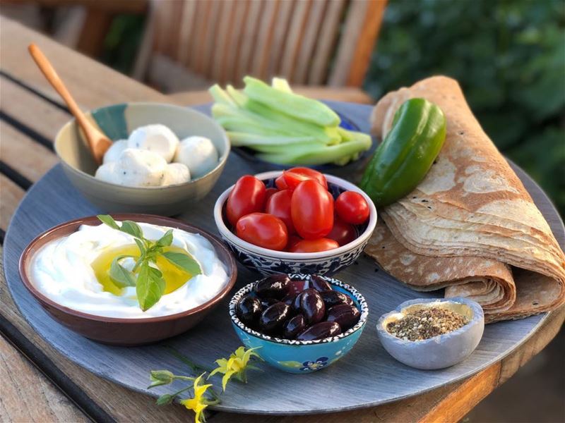 Breakfast alfresco, with the usual.  lebanesebreakfast  labneh  rawveggies...