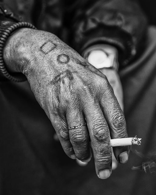 Burning time... shot taken in  beirut  hamrastreet  smoking  hands ...