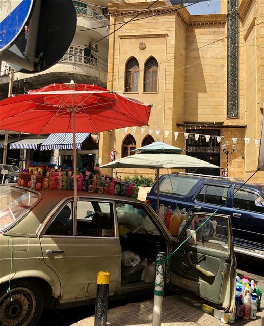 Car store in front of the mosque in a busy Beirut ‘hood, specialising in...