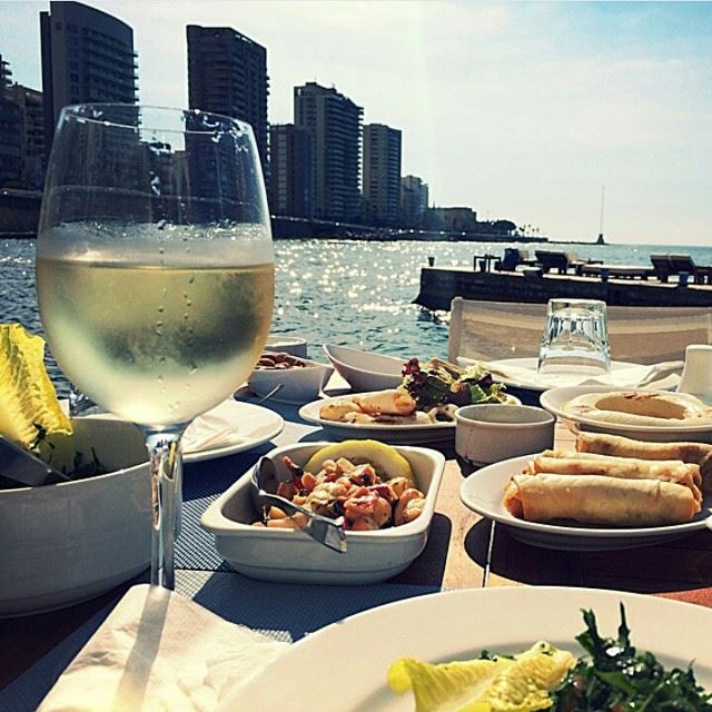 cheers from beirut shores massaya wine seafood octopus calamari tabbouleh spring sunshine lovebeirut beirutpage