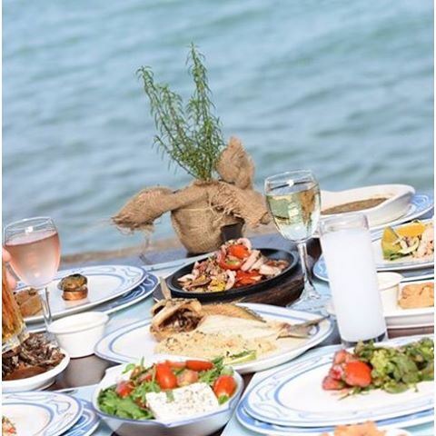 Chilling by the Mediterranean sipping on a cold one white nibbling on food.... (Al Marsa - Byblos Sur Mer)
